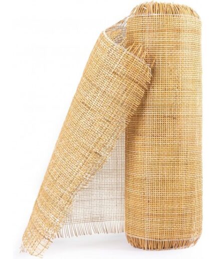 Rolled woven reed matting standing upright with a loose unrolled section showing its beige weave.